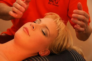 Shiatsu massage on woman's head